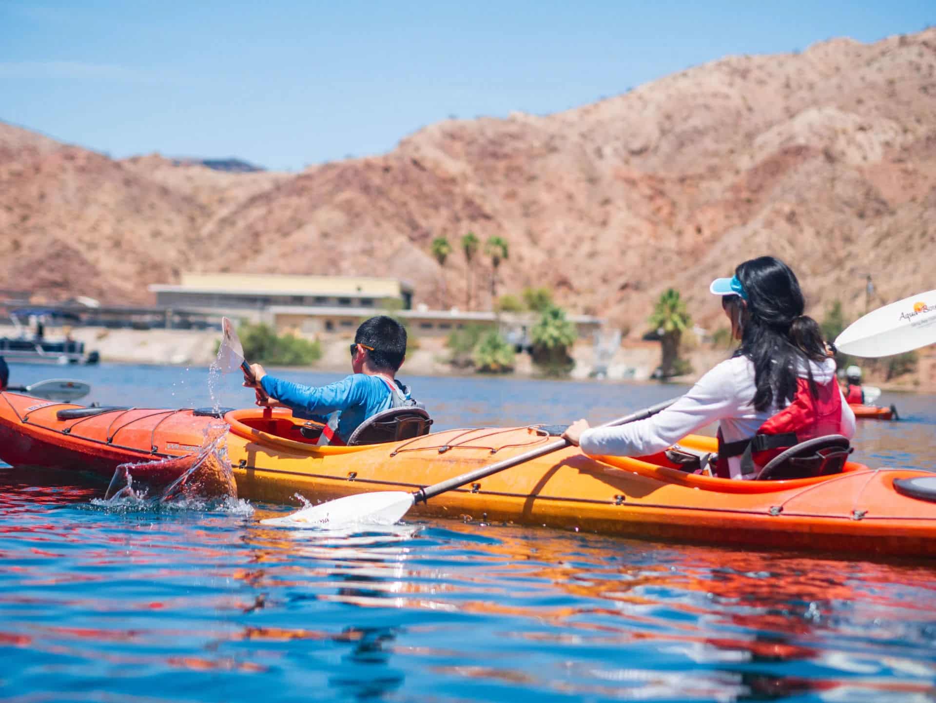 Mother and son kayaking together to Emerald Cave