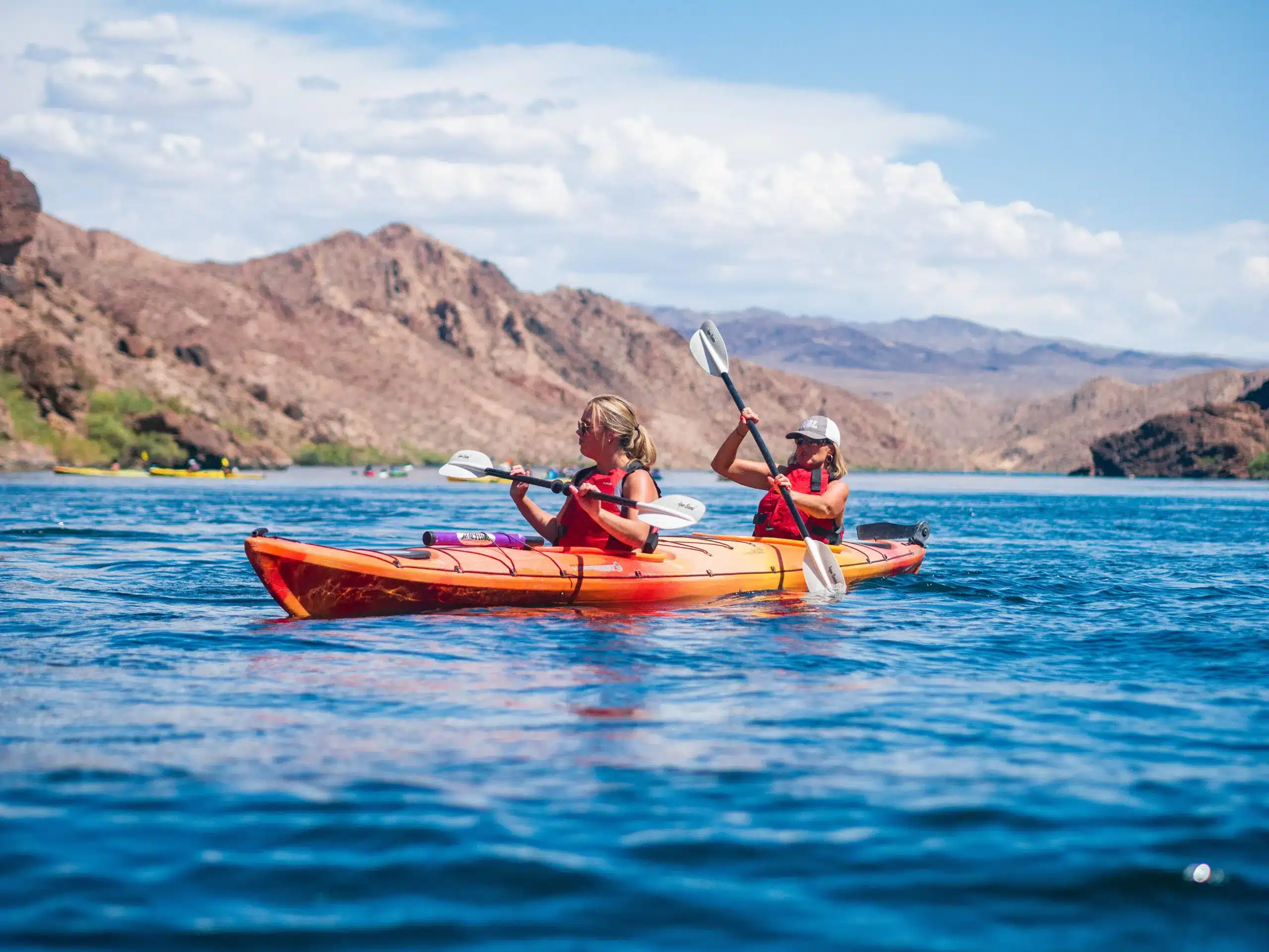 Kayak tour group exploring the Colorado River canyons